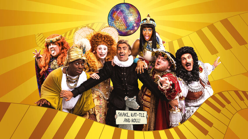 Cast of Horrible Histories dressed up as various historical figures under a disco ball