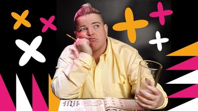 Kim Blythe sat with an unimpressed look on their face,. They are leaning on their hand, holding a pint with a crossword in front of them,Kim Blythe sat with an unimpressed look on their face,. They are leaning on their hand, holding a pint with a crossword in front of them
