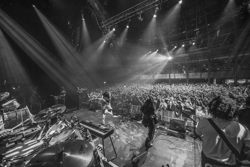 The Go! Team performing on stage at the Roundhouse