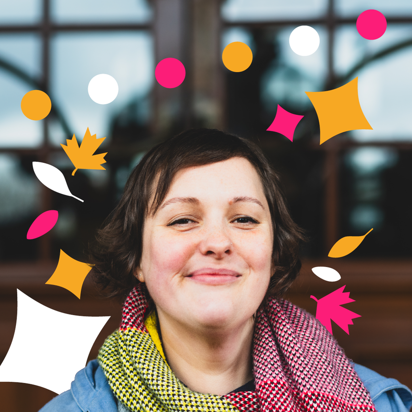 Josie wearing a red and green scarf smiling