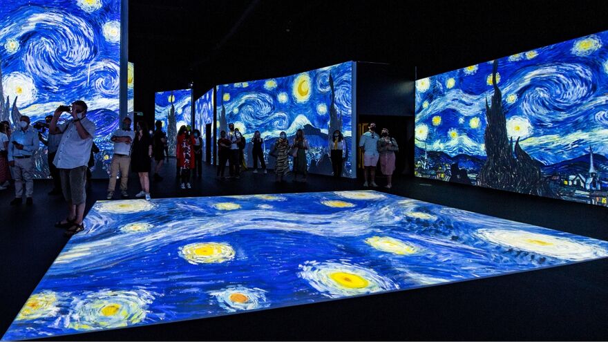 Inside Van Gogh Alive with starry night on the floors and walls