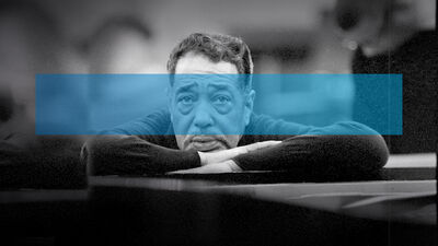 Duke Ellington leaning on a piano with a blue rectangle overlayed on the image