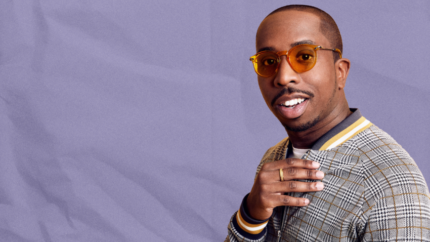 Kiell Smith-Bynoe with orange sunglasses on against a purple background