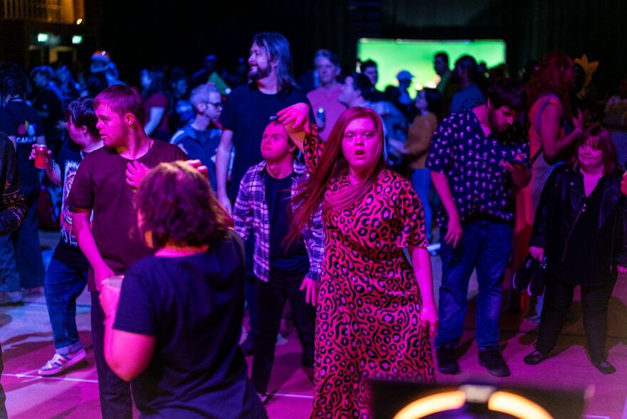Log in Sign up for free You said: Blue Camel Club_Corn Exchange_Dancer 1_10.12.25 - Photo by Ollie Denton .jpg write alt text for this  ChatGPT said: A crowd dances at a nightclub under vibrant pink, purple and blue lighting, with a woman in a pink leopard-print dress standing in the foreground.