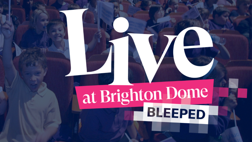 Text reading 'Live at Brighton Dome BLEEPED' overlaid on an image of young people in Brighton Dome Concert Hall. The word 'BLEEPED' is pixelated