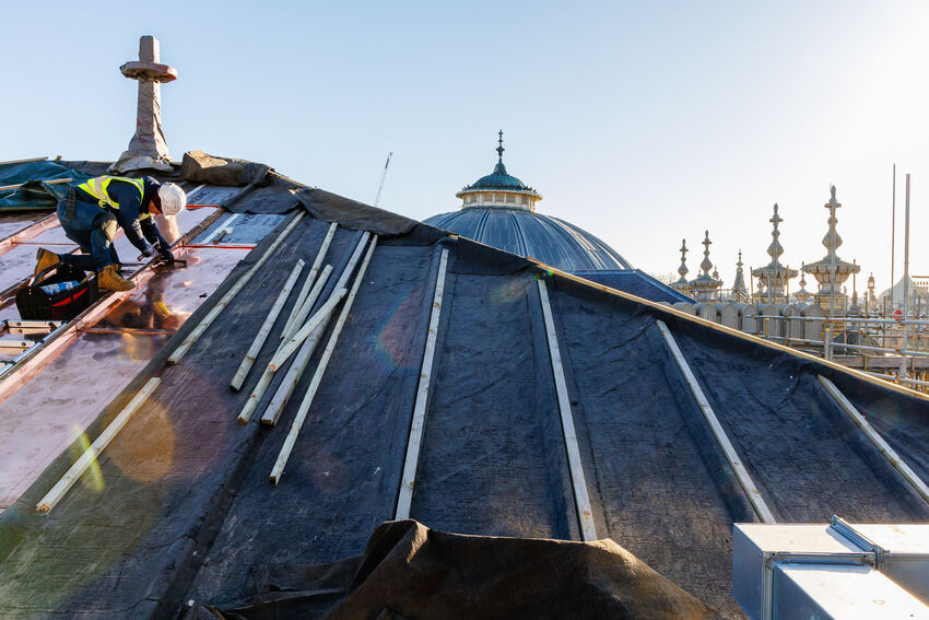 A builder working on the Brighton Dome Corn Exchange roof