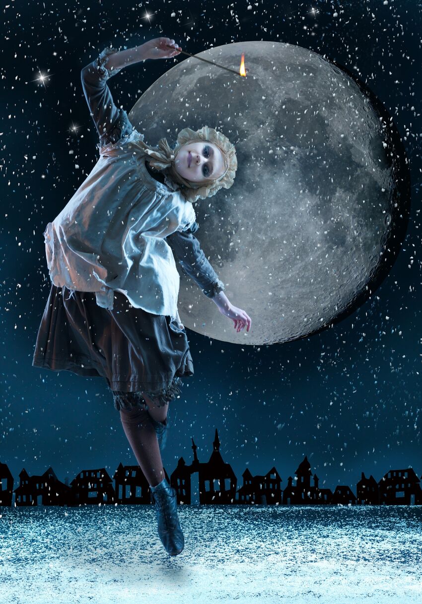 Young girl holds a match situated in a background that features a large moon