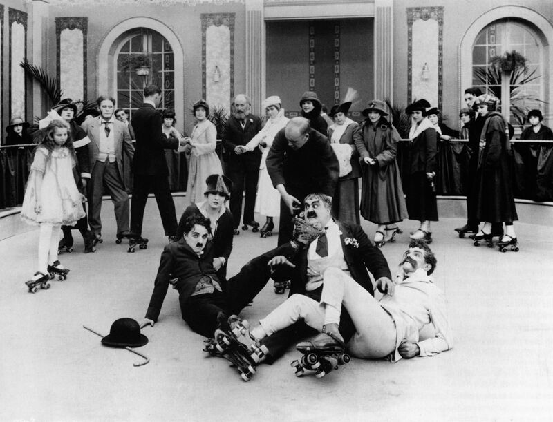 Old photo of lots of people on the floor after falling over on a rollerstaking ring