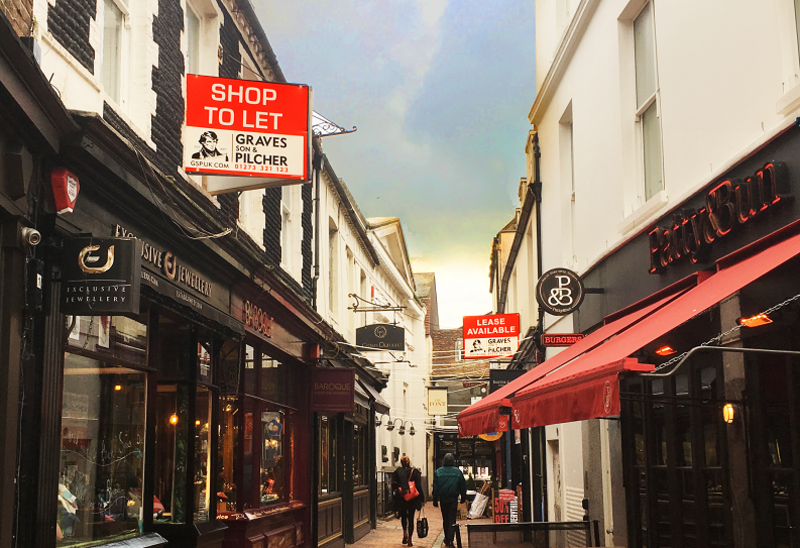 Brighton North Laine with Graves Son & Pilcher 'Shop To Let' signs up on buildings