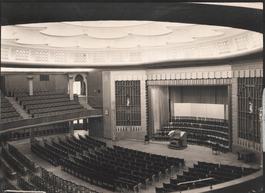 Brighton Dome Concert Hall after the 1930's redevelopment. The image is black and white and shows the organ and seating areas.