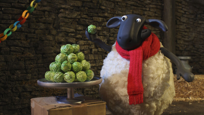 Shaun the Sheep next to a pile of brussel sprouts
