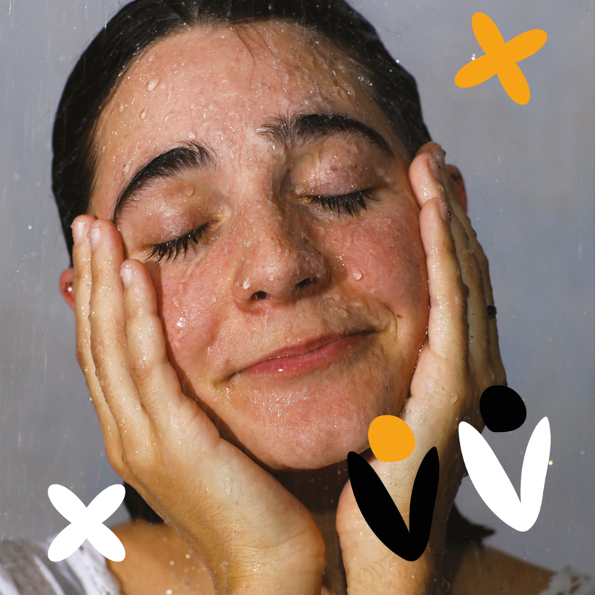 Lara Ricote with her hands on her cheeks and her eyes closed peacefully