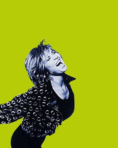 Lulu in a blue tone picture screaming with her arms behind her back. She stands over a lime green plain background