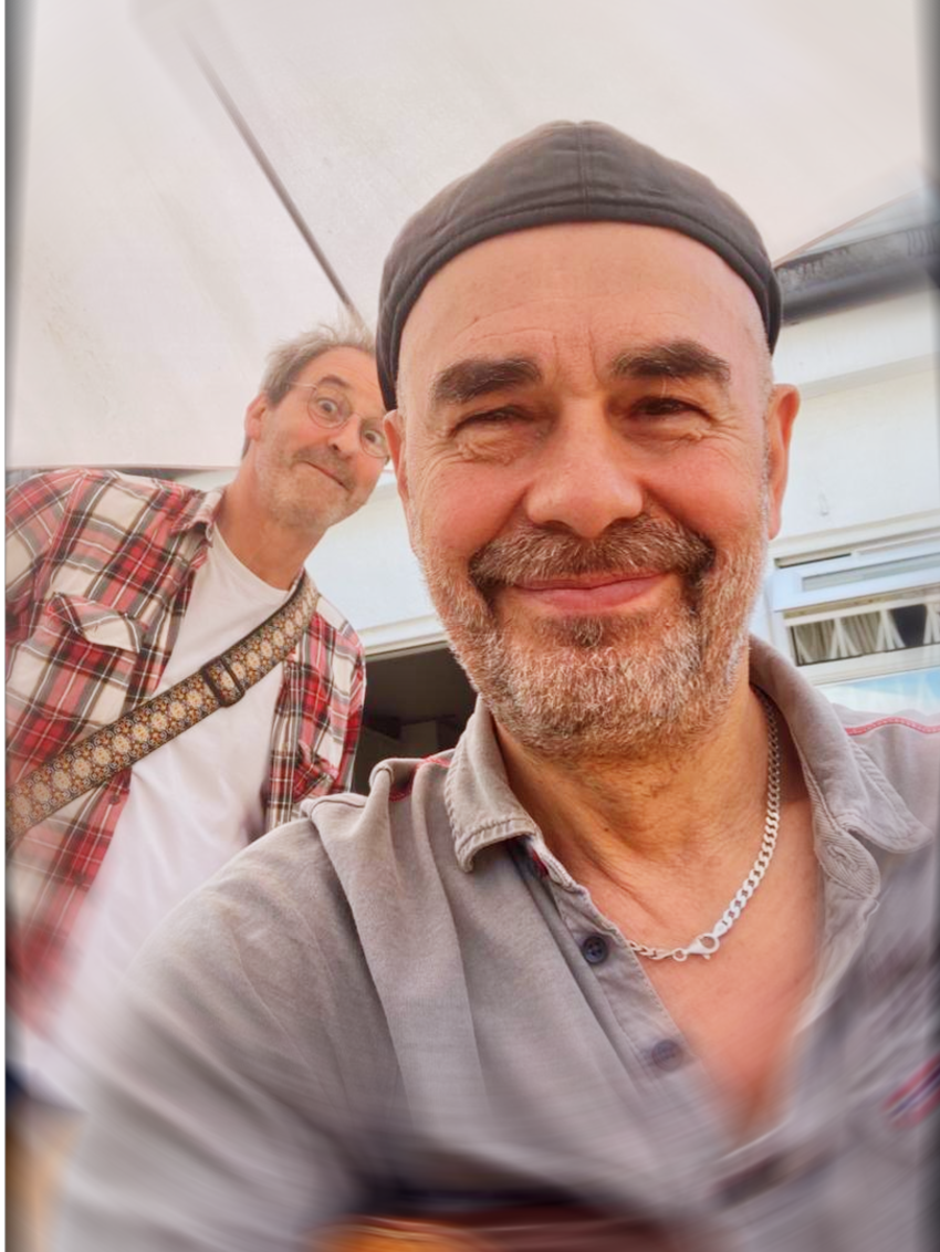 Boothby Graffoe & Antonio Forcione smiling at the camera