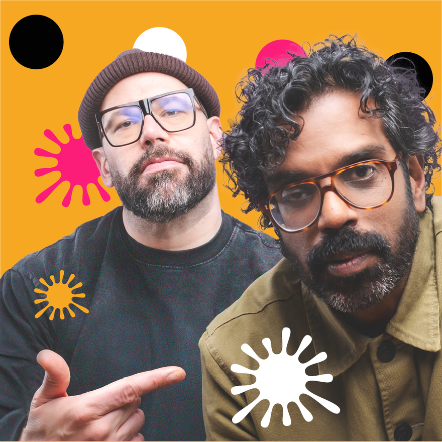 Two men with glasses, with one pointing at the other. They're in front of a yellow background with pink, white and black spots