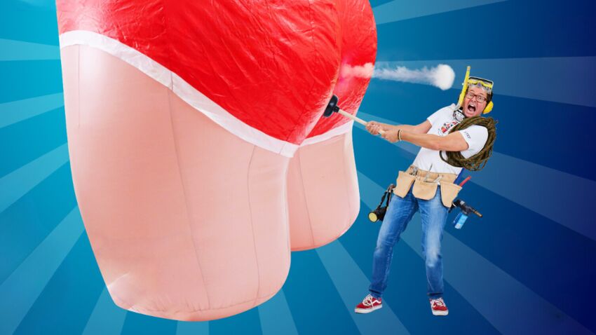 A man wearing snorkelling equipment holds a plunger up to an enormous inflatable bottom while screaming