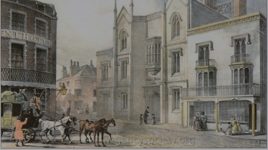 A town square with a horse and cart entering it