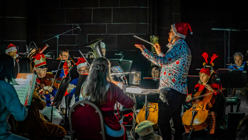 Live Orchestra wearing christmas hats