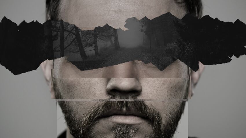 A man's face with black paper obscuring his eyes. The BSL icon is overlayed