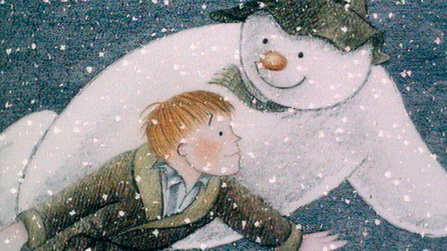 snowman holds boy as he flies in the sky with him