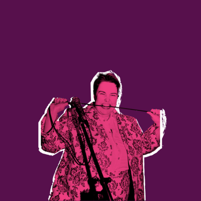 Erin Enfys wearing a patterned suit and biting down on a microphone cable. The image is overlayed on a purple background as if stuck on by hand