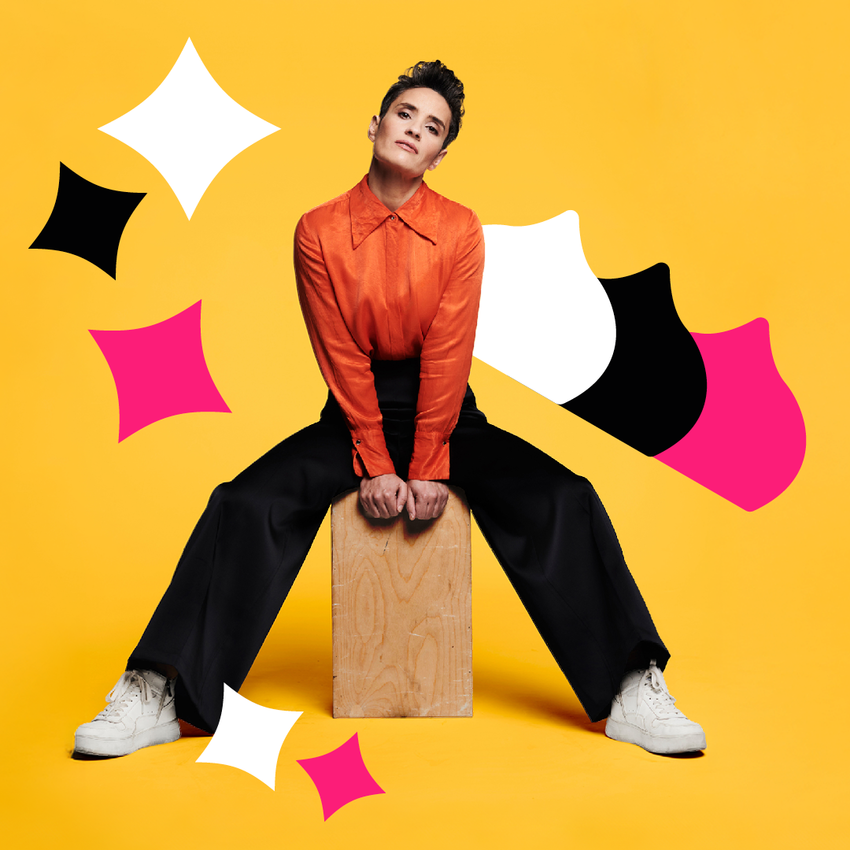 Jen Brister sat on a wooden block over a yellow background