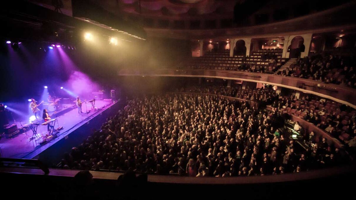 A picture of a full auditorium at a Warpaint gig