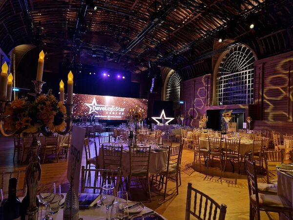 Brighton Dome Corn Exchange filled with tables and chairs for a Dining event