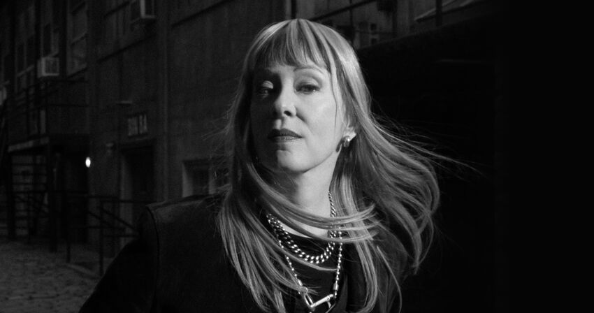black and white press shot of Suzanne Vega