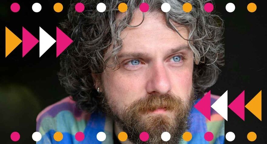 Alfie Brown staring to the right, surrounded by pink, white and yellow spots and triangles