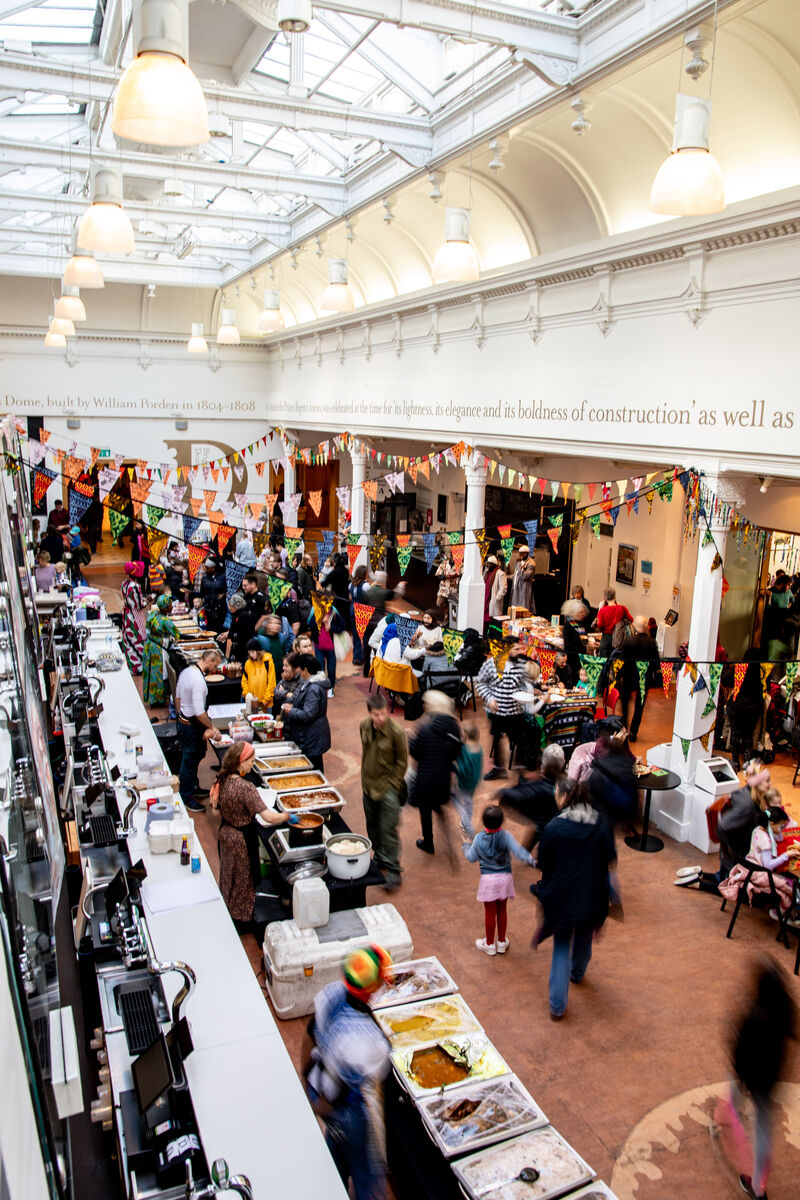 Brighton Dome Foyer filled with people and decorated with bunting 