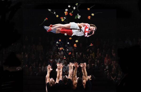 Two people being thrown into the air while surrounded by flowers