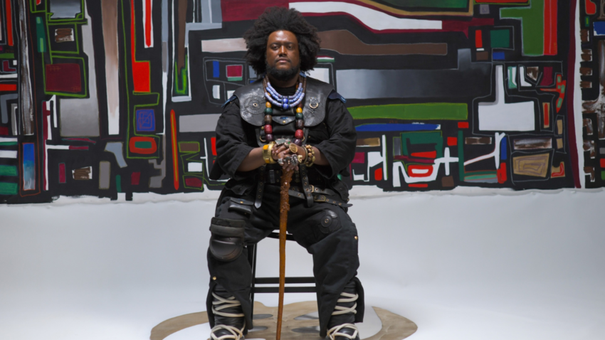 shot of Kamasi Washington sat in a chair