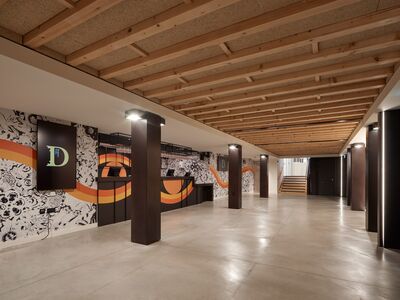 A long shot of the Festival bar, showcasing the lively black and white wallpaper