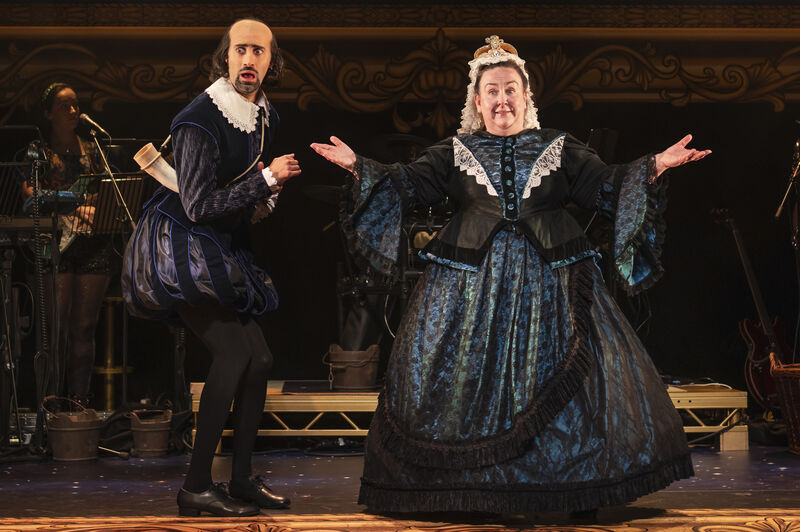 A man dressed as William Shakespeare looks shocked next to a woman dressed as Queen Victoria who has her hands held out beside her