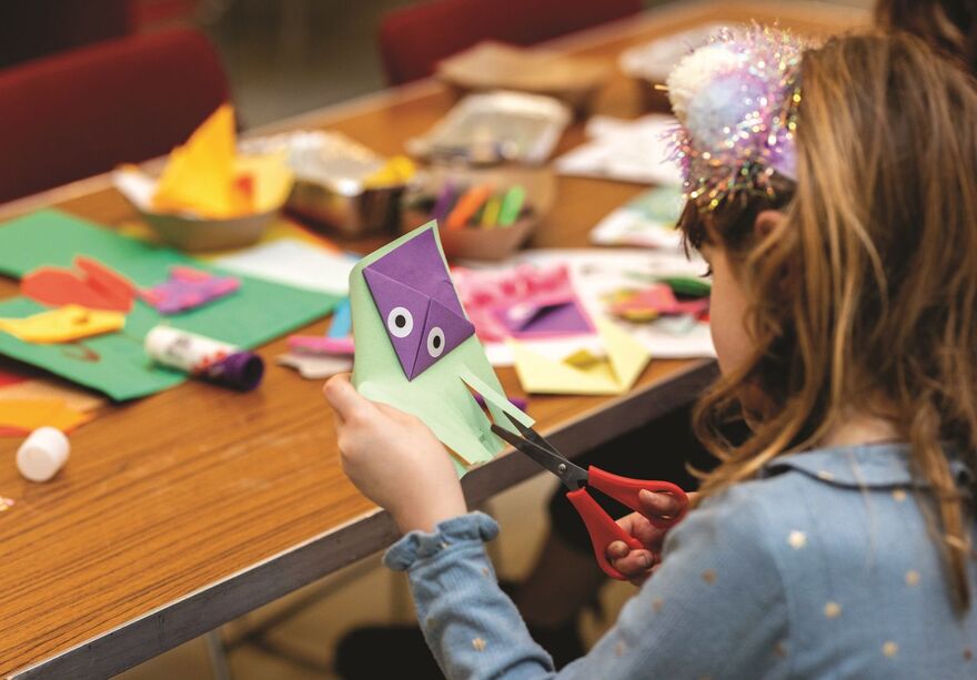 Girl crafting a puppet