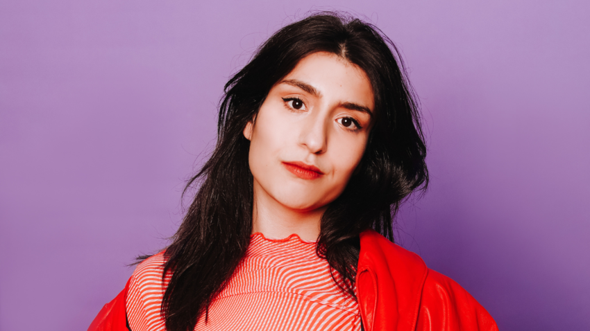 image of celya against a purple wall