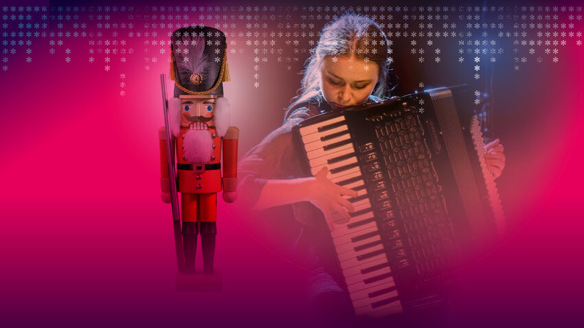 A nutcracker and a woman playing an accordian with a pink hue
