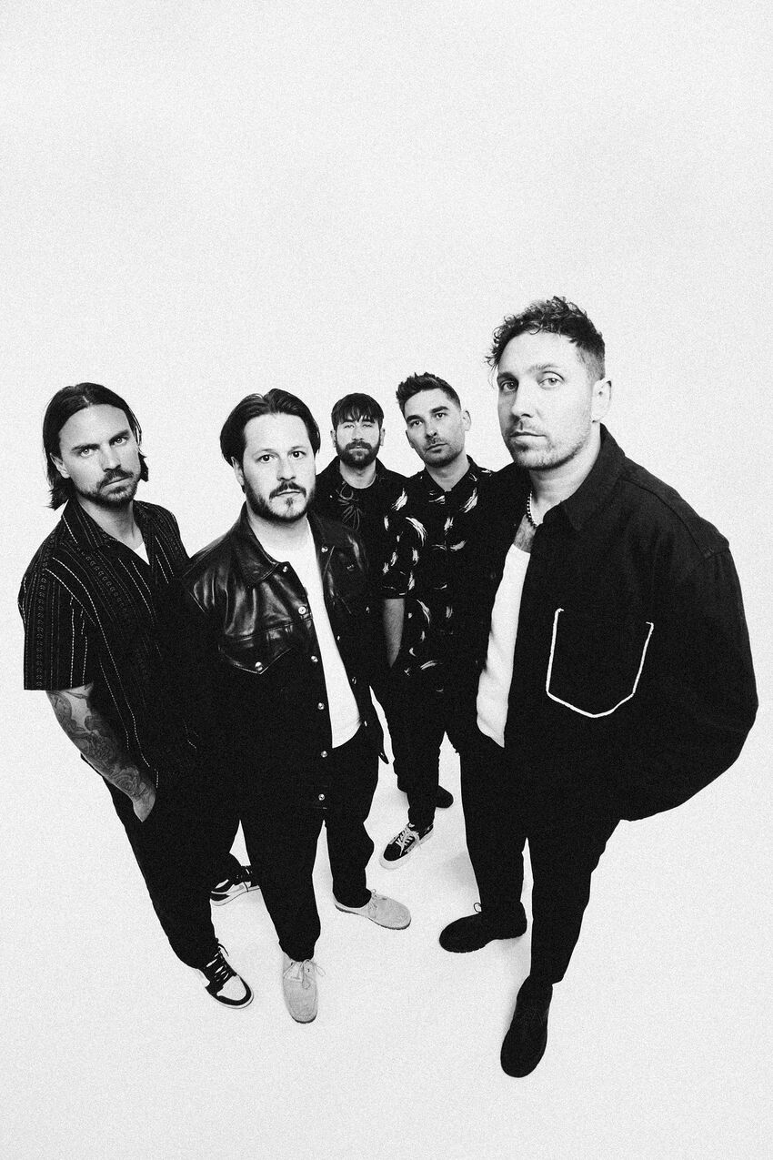 You Me At Six wearing casual clothes looking seriously at camera