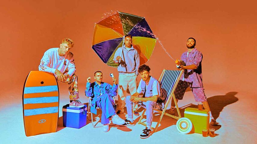 Easy Life against an orange background surrounded by typical beach props like deck chairs, umbrella, coolers